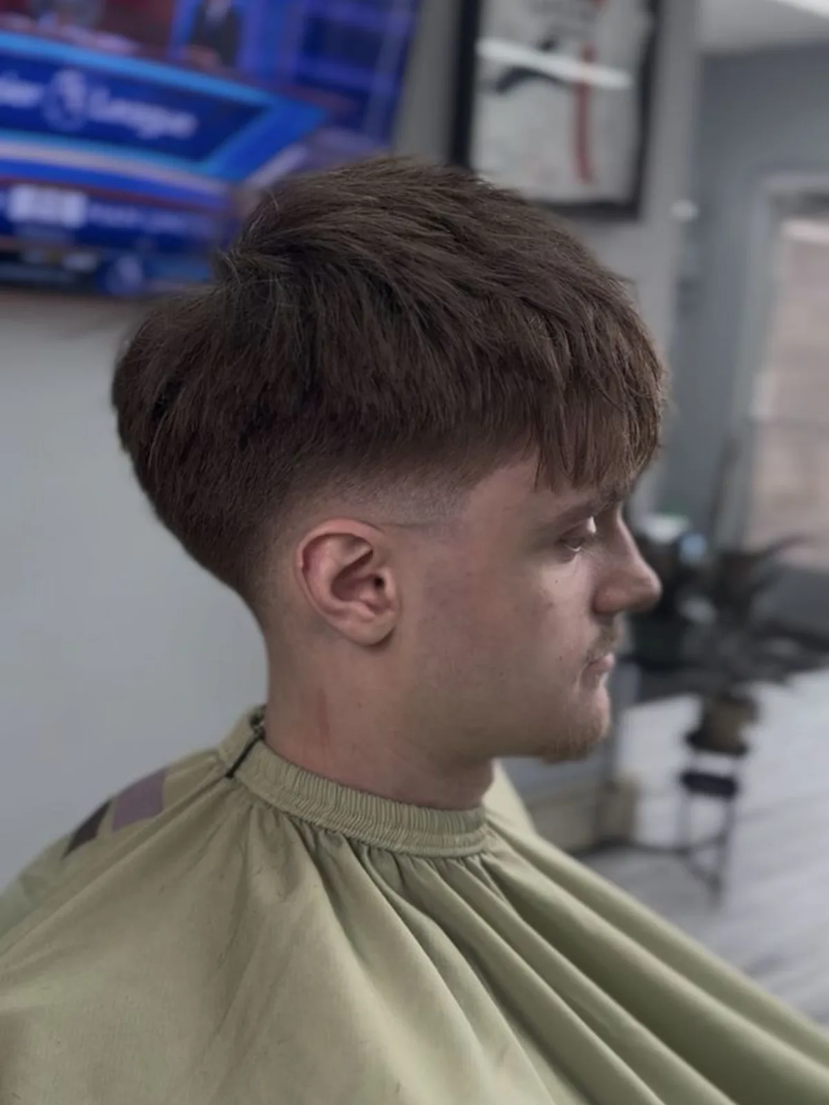 Heavy textured fringe with a mid taper fade