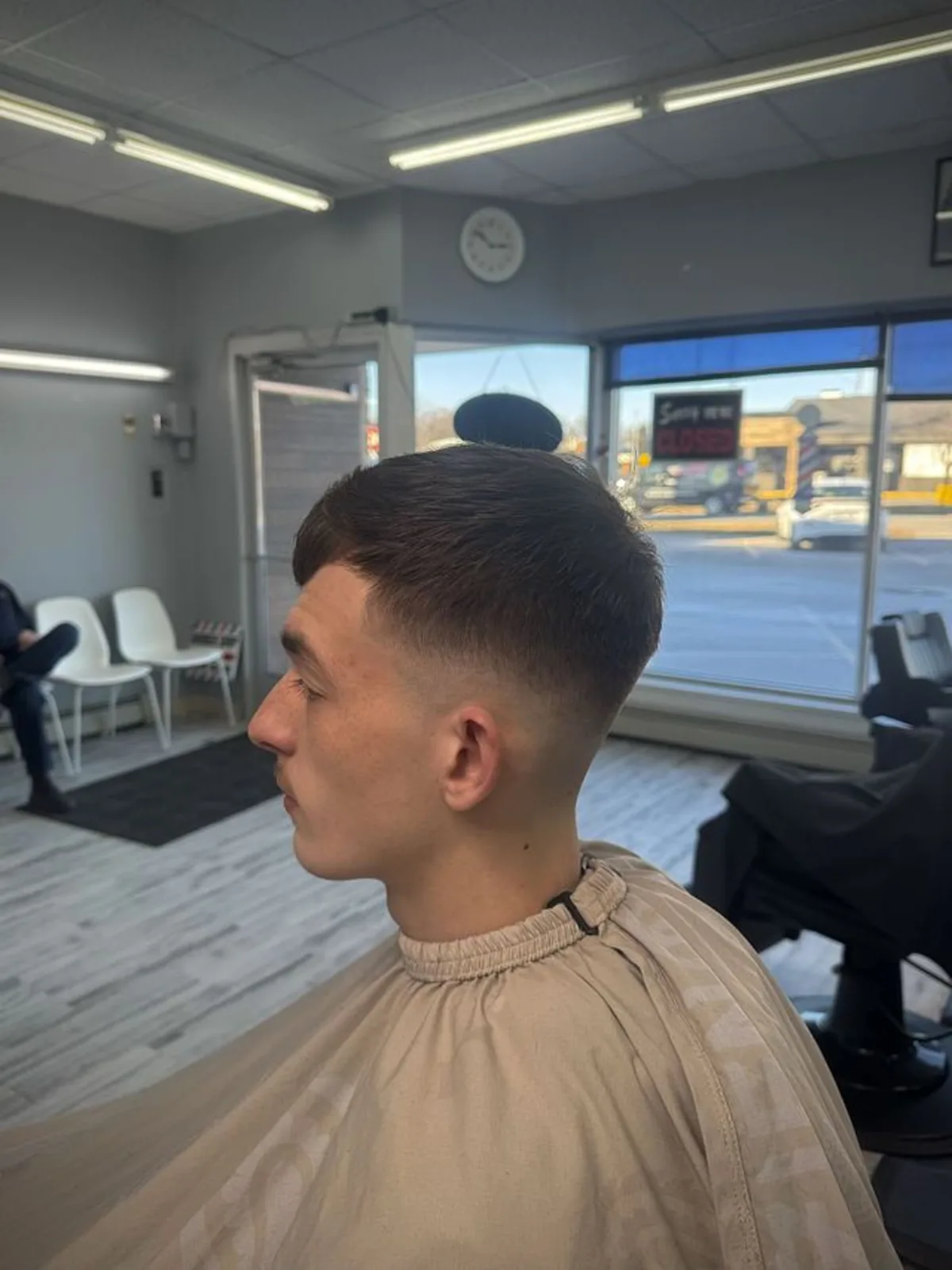 Short crop with a mid skin fade and blunt fringe