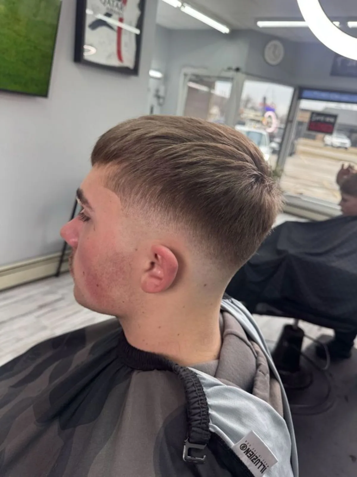Side-swept short crop with a mid drop fade