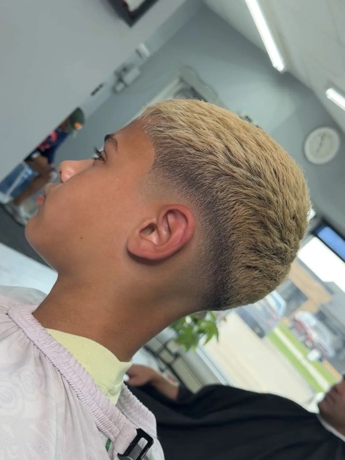 Bleached blonde textured crop with a low taper fade