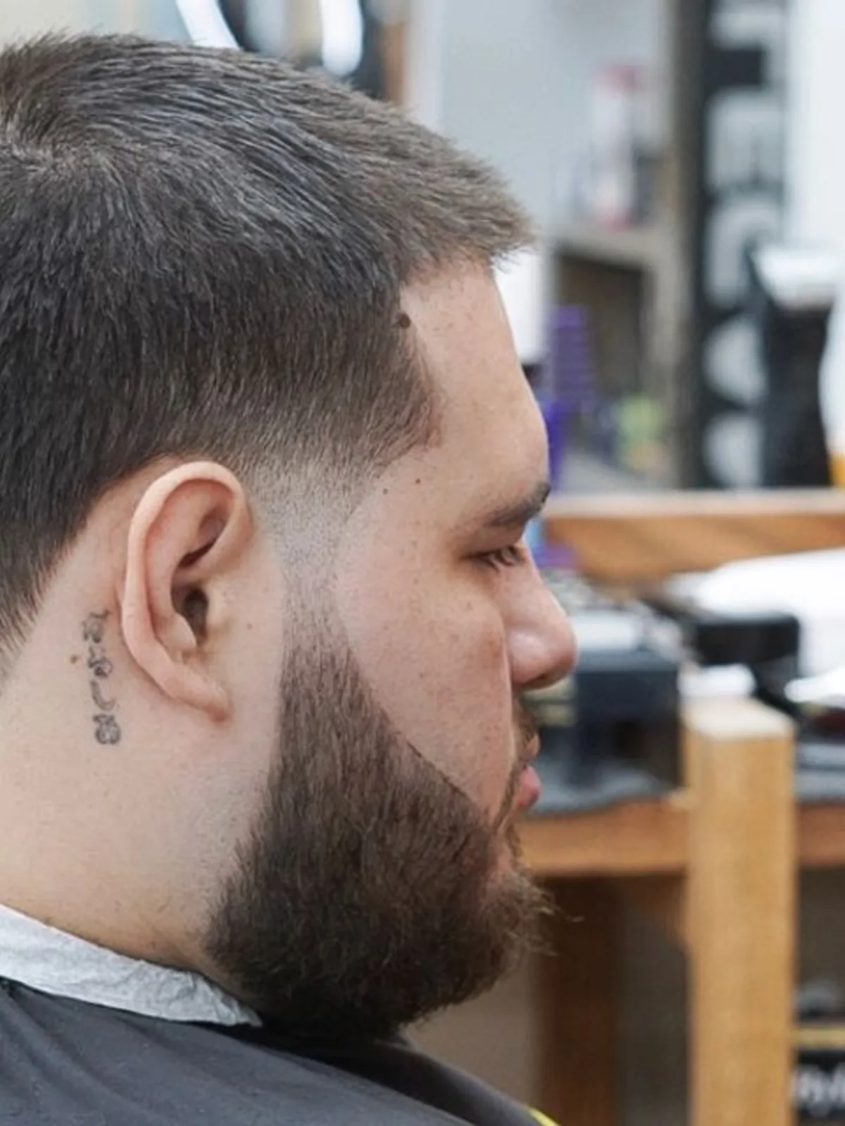 Short crop with a mid fade and full beard