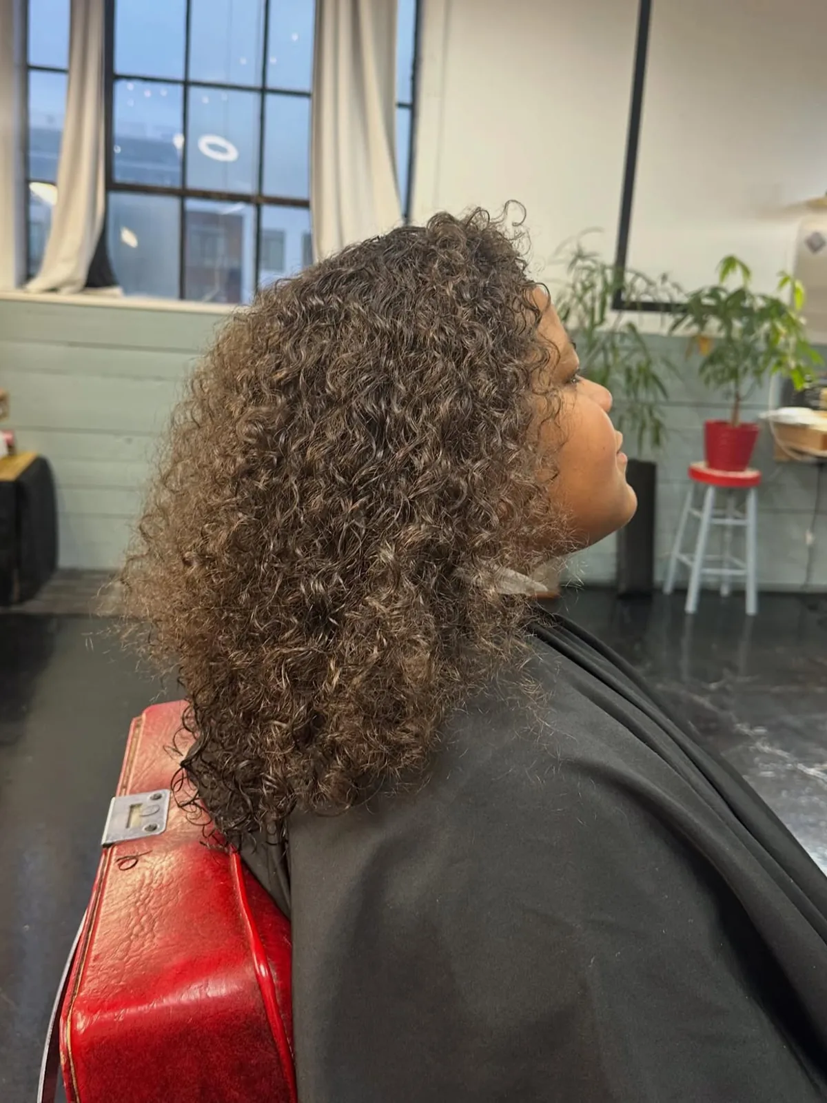 Long natural curls trimmed and shaped
