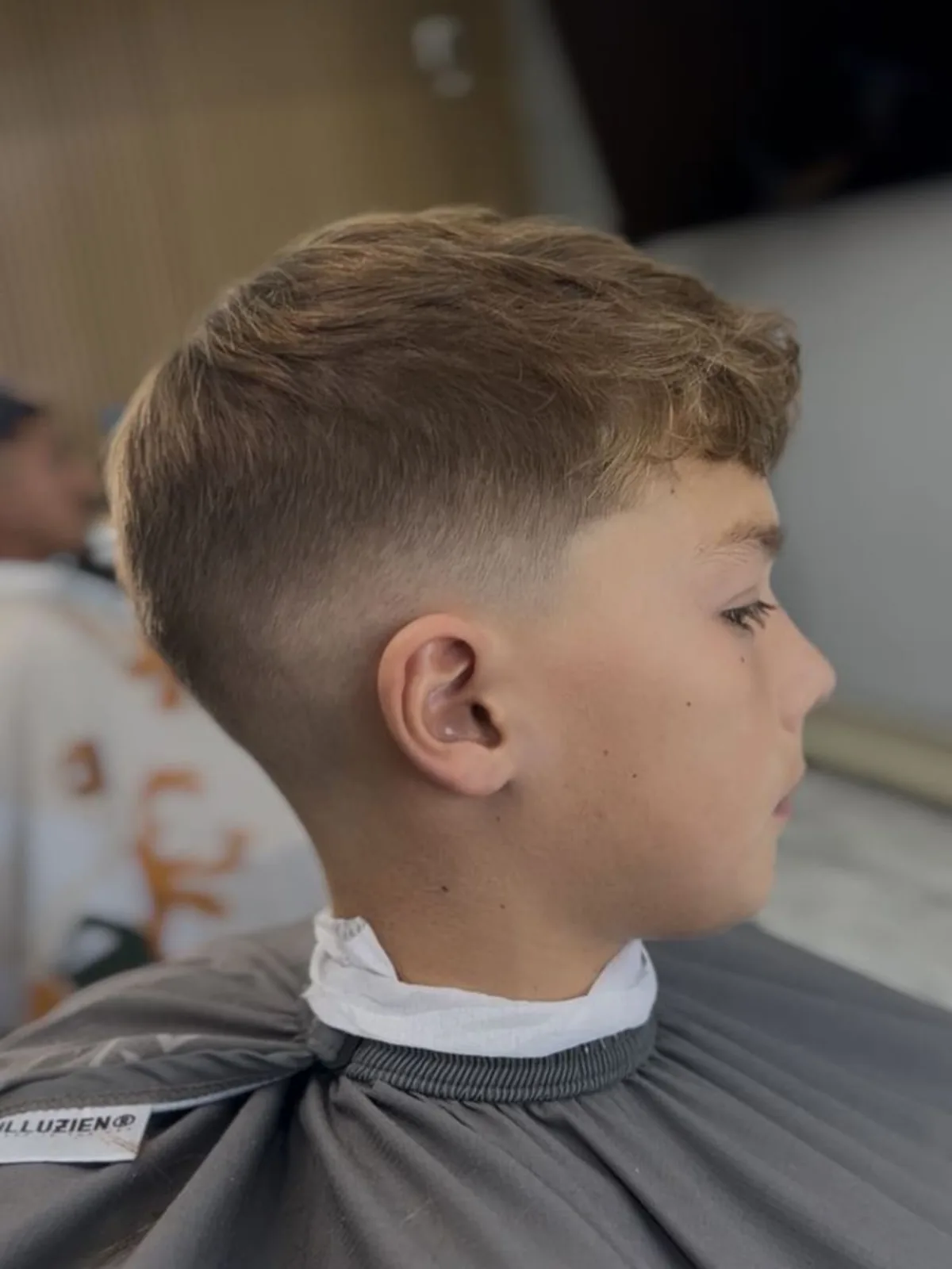 Kids light brown textured crop with a mid skin fade