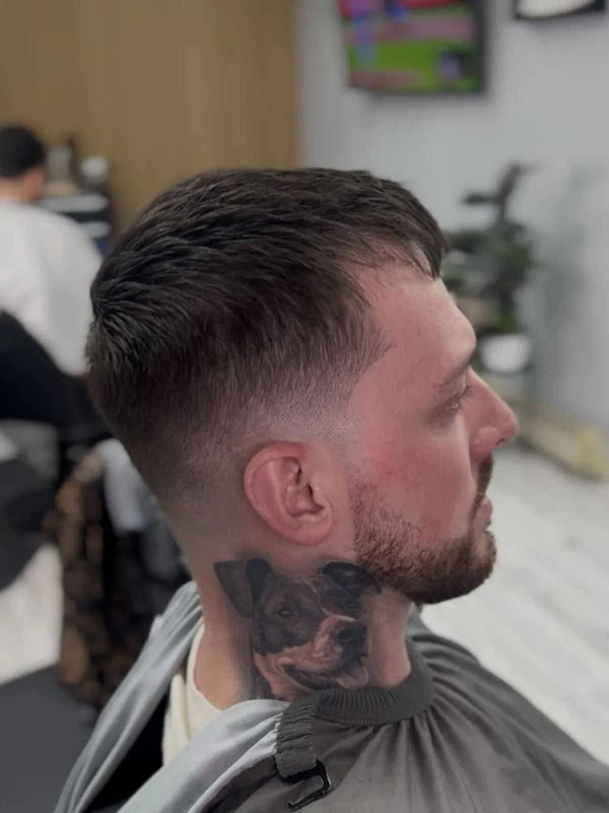 Textured crop with a low fade and trimmed beard