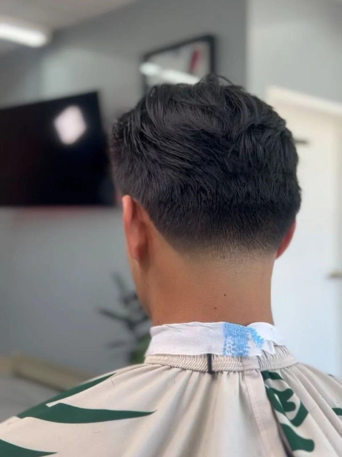 Textured top with a tapered neckline, back view